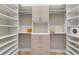 Large walk-in closet features custom shelving and hanging space for organizing clothes and accessories at 14803 Derna Ter, Bradenton, FL 34211