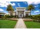 Well-manicured lawn and landscaping create an inviting entrance to the community clubhouse at 14803 Derna Ter, Bradenton, FL 34211