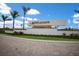 Elegant community entrance with a sign amidst lush landscaping and a welcoming atmosphere at 14803 Derna Ter, Bradenton, FL 34211