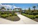 An inviting entrance to the community garden with raised beds and an area for neighborhood gatherings at 14803 Derna Ter, Bradenton, FL 34211