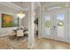 Elegant foyer featuring a decorative chandelier, neutral decor, and views to the property's exterior at 14803 Derna Ter, Bradenton, FL 34211