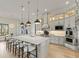 Gourmet kitchen with a center island, pendant lighting, and stainless steel appliances at 14803 Derna Ter, Bradenton, FL 34211