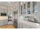 Bright kitchen with stainless steel appliances, custom cabinetry, and quartz countertops at 14803 Derna Ter, Bradenton, FL 34211