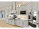 Gourmet kitchen features stainless steel appliances, custom cabinets and under cabinet lighting at 14803 Derna Ter, Bradenton, FL 34211