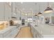 A large open-concept kitchen with stainless steel appliances and white quartz countertops at 14803 Derna Ter, Bradenton, FL 34211