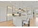 Spacious open kitchen features an island with seating and stainless appliances at 14803 Derna Ter, Bradenton, FL 34211