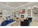 Cozy living room features a fireplace, built-in shelving and comfortable seating at 14803 Derna Ter, Bradenton, FL 34211