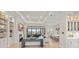 Spacious living room with built-in shelves, fireplace, and sliding glass doors that open to the outdoors at 14803 Derna Ter, Bradenton, FL 34211