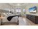 Luxurious main bedroom with bay window, tray ceiling, and decorative details for added style at 14803 Derna Ter, Bradenton, FL 34211
