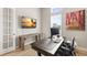 Office with built-in shelving, natural light, a large monitor, and stylish decor at 14803 Derna Ter, Bradenton, FL 34211