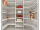 Well-organized pantry with ample shelving for food storage and kitchen items at 14803 Derna Ter, Bradenton, FL 34211
