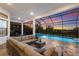 Relaxing outdoor patio area with comfortable seating and views of the pool and sunset at 14803 Derna Ter, Bradenton, FL 34211