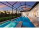 Beautiful screened-in pool with attached spa and outdoor kitchen area, perfect for entertaining at 14803 Derna Ter, Bradenton, FL 34211