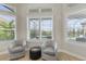 Cozy sunroom featuring comfortable chairs, views of the pool area, and lots of natural light at 14803 Derna Ter, Bradenton, FL 34211