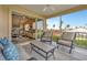 Relaxing screened balcony with comfortable seating and views of the community at 1620 Fairway Trce # B, Palmetto, FL 34221