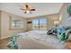 Comfortable bedroom with two windows offering natural light and peaceful views at 1620 Fairway Trce # B, Palmetto, FL 34221