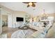 Comfortable living room featuring tile floors, a ceiling fan, and easy access to other rooms at 1620 Fairway Trce # B, Palmetto, FL 34221