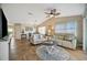 Inviting living room with tile flooring, ceiling fan, and comfortable seating arrangement at 1620 Fairway Trce # B, Palmetto, FL 34221