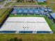 Aerial shot showcases pristine beach volleyball courts, an active lifestyle amenity in a vibrant community at 209 111Th E St, Bradenton, FL 34212