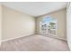 Cozy bedroom featuring carpeted floor, a window with blinds, and a closet at 209 111Th E St, Bradenton, FL 34212