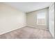 Cozy bedroom featuring carpeted floor and a window with blinds at 209 111Th E St, Bradenton, FL 34212