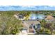 Beautiful single-Gathering home boasts a well-manicured lawn and mature trees, creating a welcoming curb appeal at 209 111Th E St, Bradenton, FL 34212