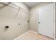 Compact laundry room with tile floors, wire shelving, and utility hookups at 209 111Th E St, Bradenton, FL 34212