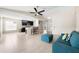 Living room and kitchen with barstool seating, neutral paint, and tile floors at 209 111Th E St, Bradenton, FL 34212