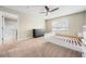 Main bedroom features ensuite bath, dresser and cozy carpet at 209 111Th E St, Bradenton, FL 34212