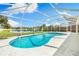 Screened in pool with lake view, perfect for relaxing and entertaining in the backyard of this lovely home at 209 111Th E St, Bradenton, FL 34212