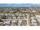 Expansive aerial view of a serene residential community with picturesque homes nestled among lush greenery and waterways at 211 Dalton Blvd, Port Charlotte, FL 33952