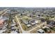 Neighborhood aerial showcases cozy homes, lush greenery, and convenient access to local amenities at 211 Dalton Blvd, Port Charlotte, FL 33952