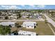 Overhead view of a quiet neighborhood featuring classic homes and tidy yards in a peaceful community setting at 211 Dalton Blvd, Port Charlotte, FL 33952