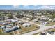 Aerial view of a residential area with well-maintained homes and neat landscaping under a bright sky at 211 Dalton Blvd, Port Charlotte, FL 33952