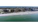 Wide aerial photo showcasing a luxury beachfront condo complex with nearby golf and city views at 2141 Gulf Of Mexico Dr Unit # 4, Longboat Key, FL 34228