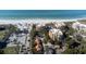 Aerial view of oceanfront condos with private pools, lush greenery, and direct beach access at 2141 Gulf Of Mexico Dr Unit # 4, Longboat Key, FL 34228