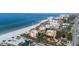 Gorgeous aerial view of beachfront condos, manicured landscaping, and pristine beach at 2141 Gulf Of Mexico Dr Unit # 4, Longboat Key, FL 34228