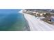 Expansive aerial view showcasing a beachfront condo complex with ocean, beach, and nearby golf course at 2141 Gulf Of Mexico Dr Unit # 4, Longboat Key, FL 34228