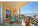 Inviting balcony with ample seating, an outdoor grill, and stunning ocean views at 2141 Gulf Of Mexico Dr Unit # 4, Longboat Key, FL 34228