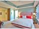Bright bedroom with light walls, a large bed, and natural light streaming through the windows at 2141 Gulf Of Mexico Dr Unit # 4, Longboat Key, FL 34228