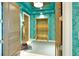 Grand elevator lobby with bronze elevator doors, gold statue and custom wall paper at 2141 Gulf Of Mexico Dr Unit # 4, Longboat Key, FL 34228