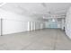 Spacious and well-lit multi-car garage with ample storage space and clean, finished walls at 2141 Gulf Of Mexico Dr Unit # 4, Longboat Key, FL 34228