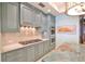 Gourmet kitchen featuring stone countertops, stainless appliances, and custom cabinetry at 2141 Gulf Of Mexico Dr Unit # 4, Longboat Key, FL 34228
