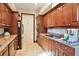 Cozy kitchenette equipped with modern appliances and sleek cabinetry at 2141 Gulf Of Mexico Dr Unit # 4, Longboat Key, FL 34228