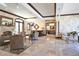 Luxurious lounge area with cozy seating, fireplace, and sophisticated decor at 2141 Gulf Of Mexico Dr Unit # 4, Longboat Key, FL 34228