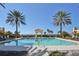Relaxing pool with a gazebo, chairs for lounging, and lush palm trees, all with stunning ocean views at 2141 Gulf Of Mexico Dr Unit # 4, Longboat Key, FL 34228