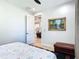 Bedroom featuring a ceiling fan, artwork, and open doorway to the interior living spaces at 2186 Yalta Ter, North Port, FL 34286