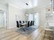 Bright dining room features a modern table set, a view of the kitchen, and an open floor plan at 2186 Yalta Ter, North Port, FL 34286