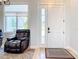 Welcoming entryway with stylish door and window, adjacent to a cozy living space at 2186 Yalta Ter, North Port, FL 34286