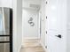 Bright hallway featuring light hardwood floors, and neutral paint at 2186 Yalta Ter, North Port, FL 34286